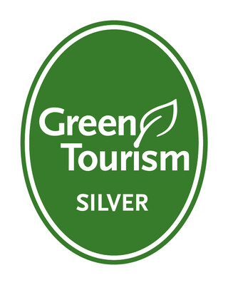 A green oval with the words 'Green Tourism Silver' inside it in white